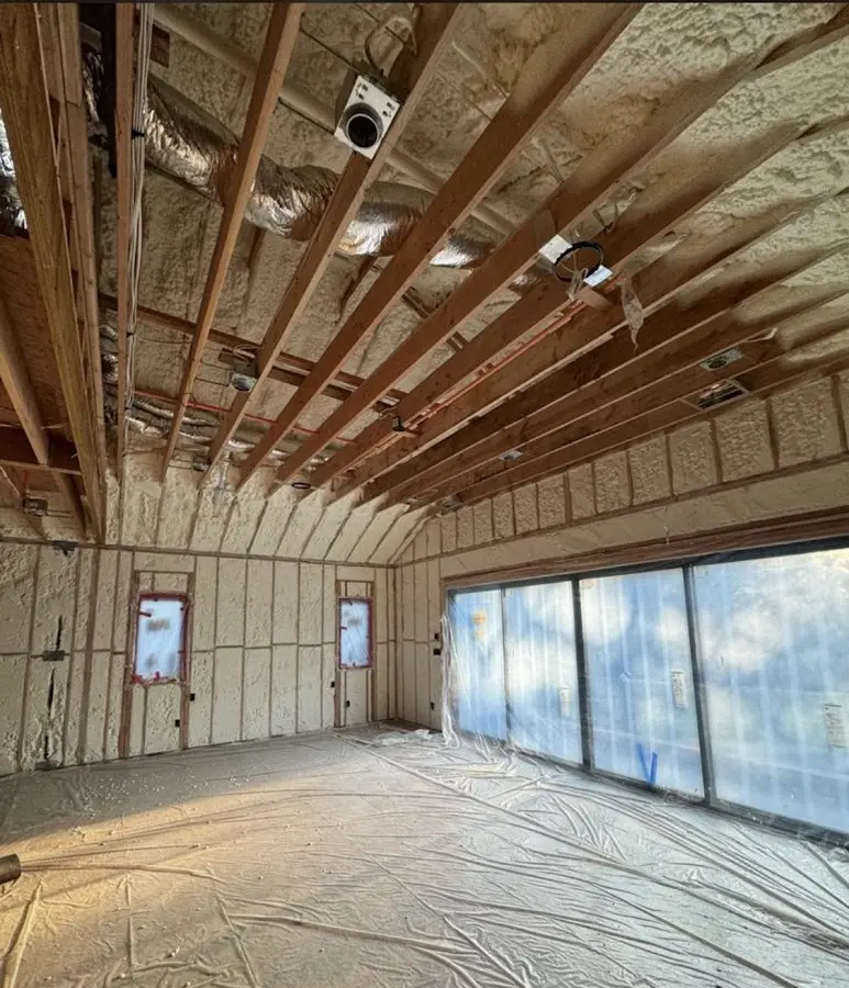 Interior walls and ceiling insulated with spray foam during new construction in Pontotoc